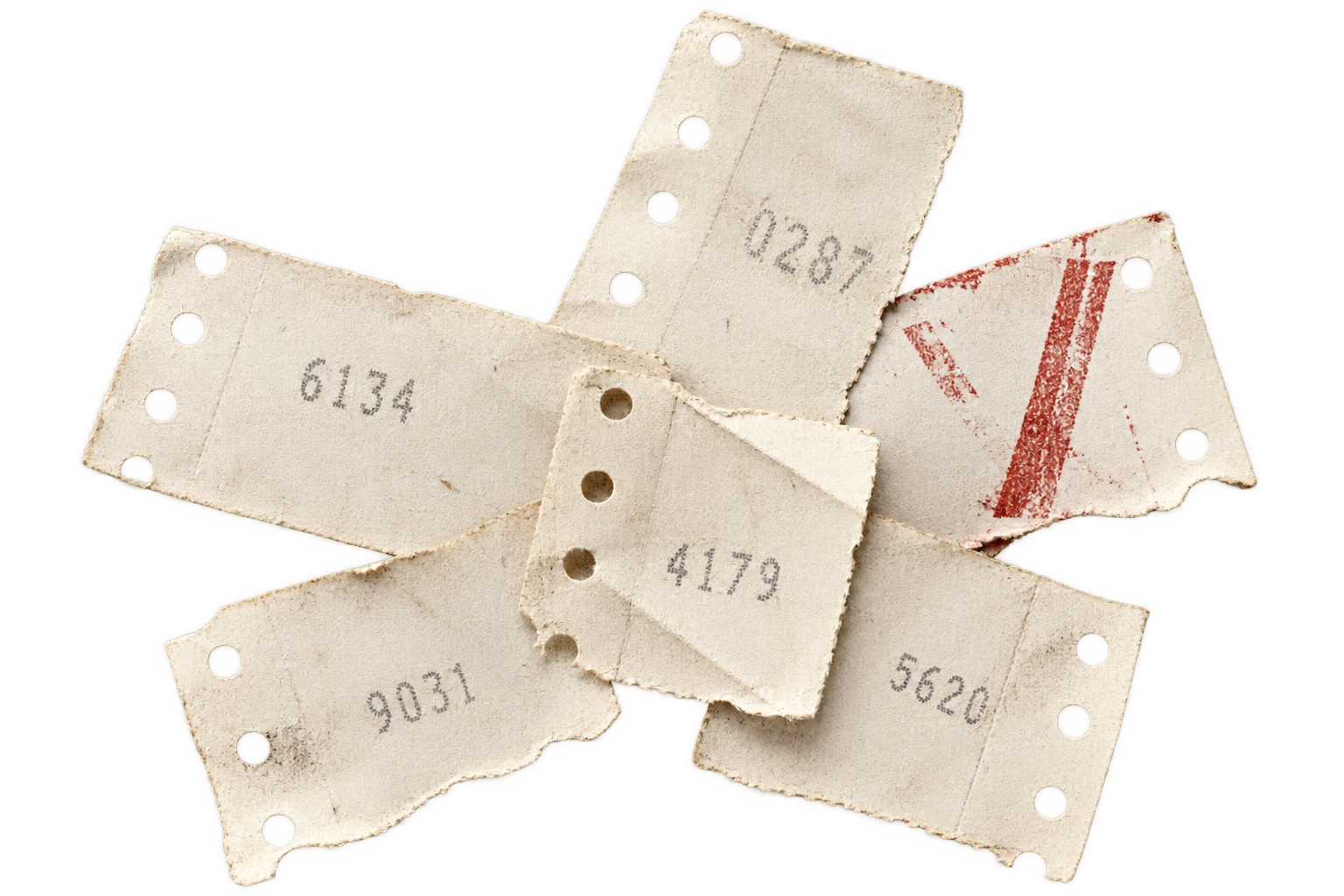 Six torn parked ticket stubs resting in the machine catch tray